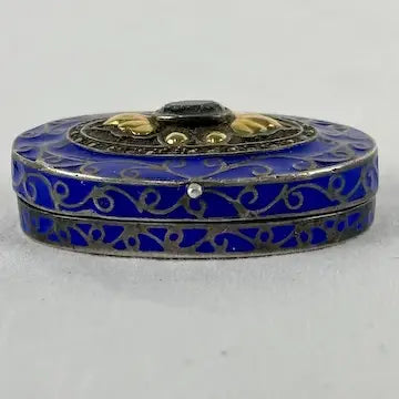 Early 20thC Oval Silver and Gold Enameled Pill Box with Tanzanite Gem