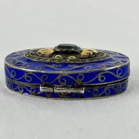 Early 20thC Oval Silver and Gold Enameled Pill Box with Tanzanite Gem