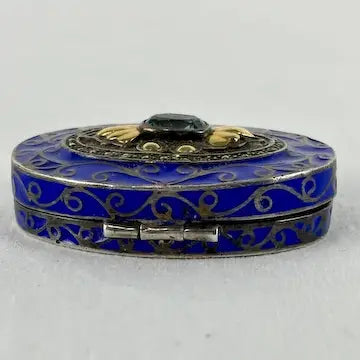 Early 20thC Oval Silver and Gold Enameled Pill Box with Tanzanite Gem